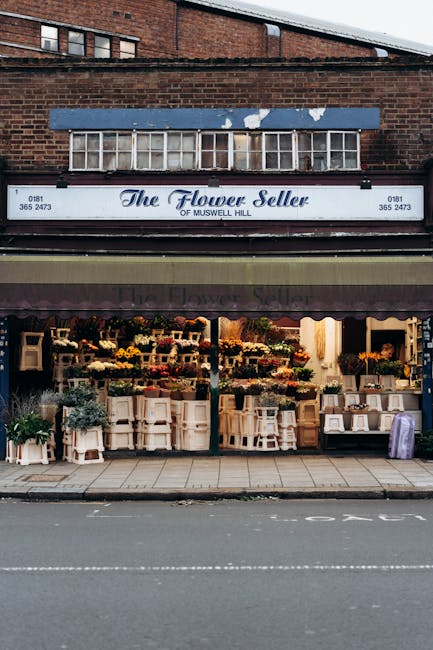 The image shows the storefront of a flower shop named 